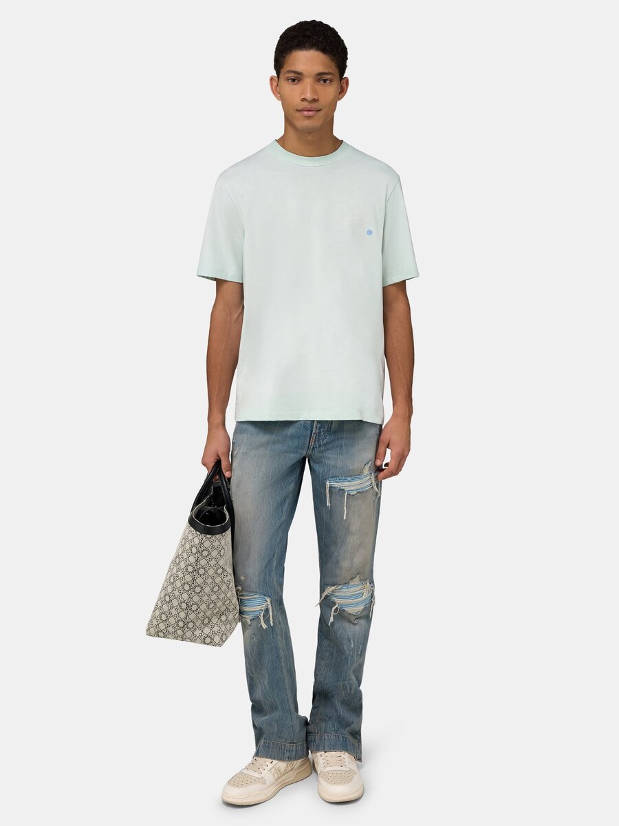 CAMISETA CON ETIQUETA DE CALIDAD Amiri