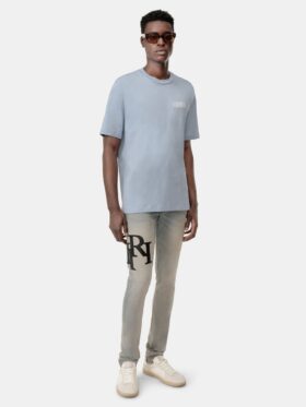 PANTALONES DE JEANS SKINNY CON LOGO DESCALADO