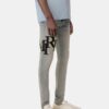 PANTALONES DE JEANS SKINNY CON LOGO DESCALADO