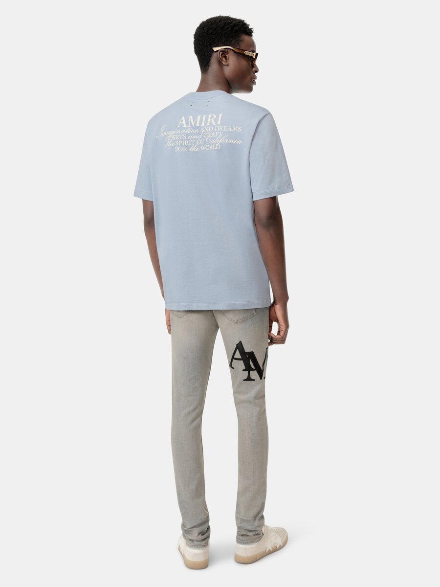 PANTALONES DE JEANS SKINNY CON LOGO DESCALADO