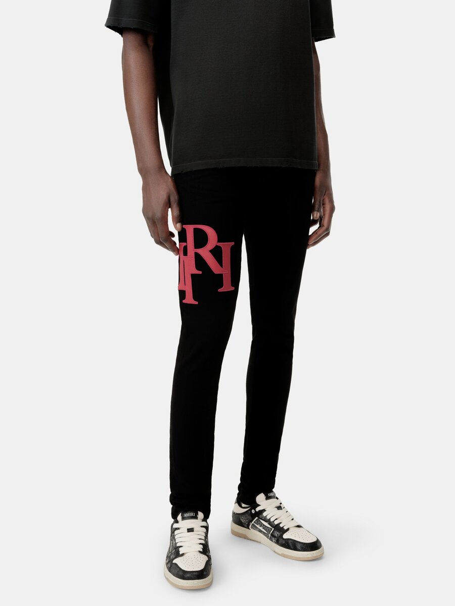 PANTALONES DE JEANS SKINNY CON LOGO DESCALADO - Negro Rojo