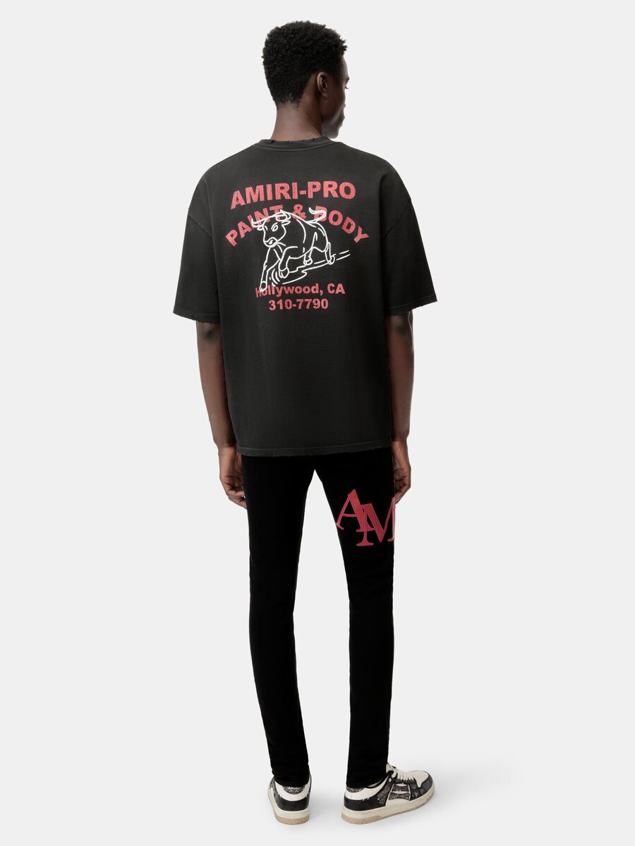 PANTALONES DE JEANS SKINNY CON LOGO DESCALADO - Negro Rojo
